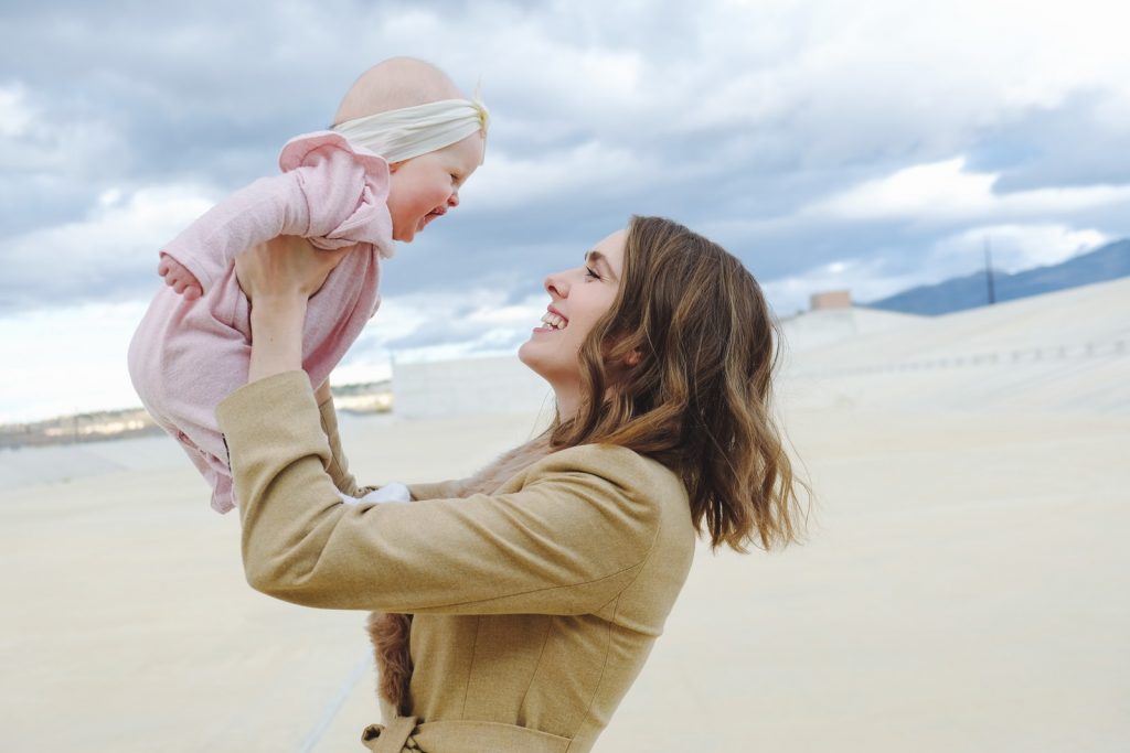 woman carrying child